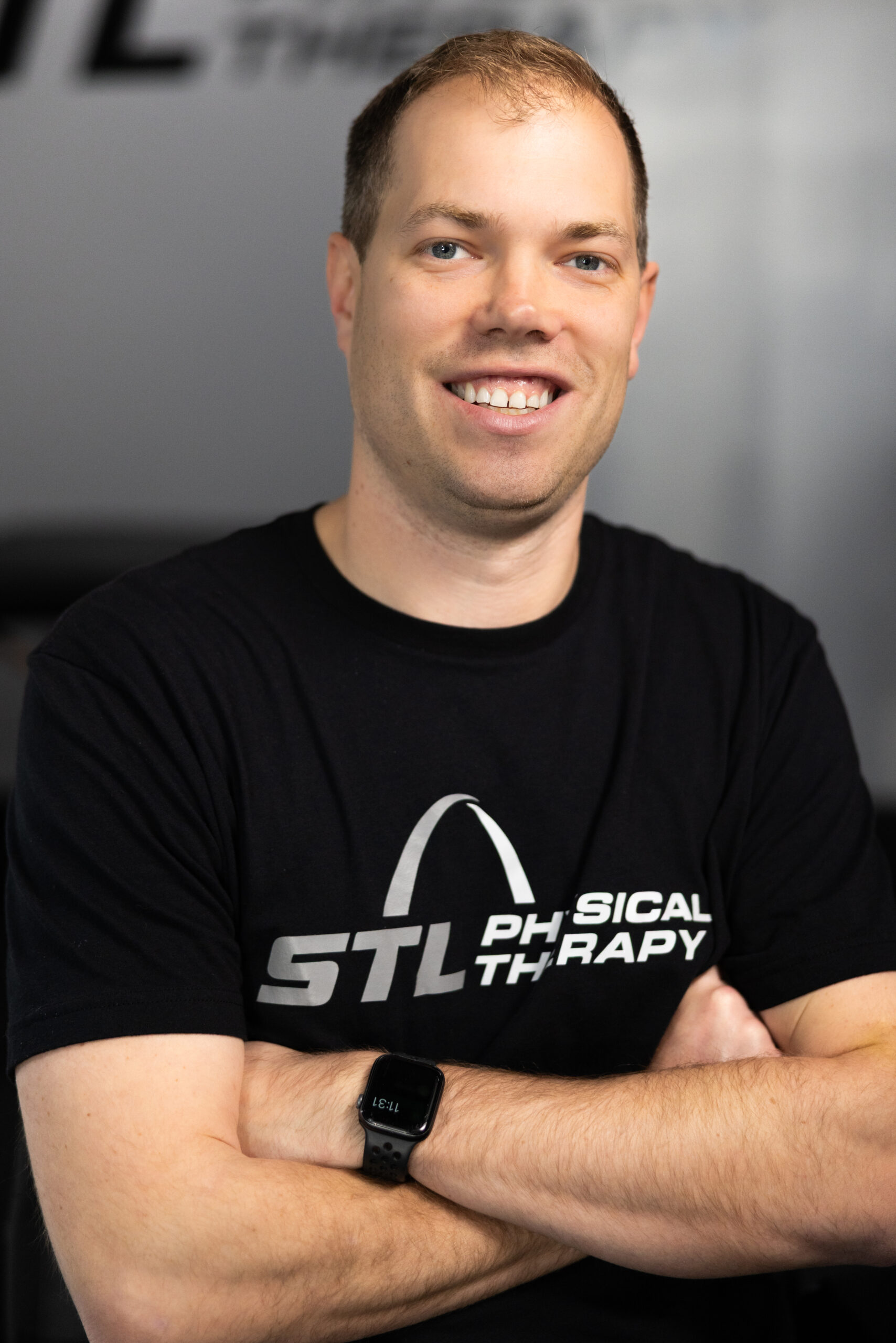 STL Physical Therapy physical therapist smiling with arms crossed